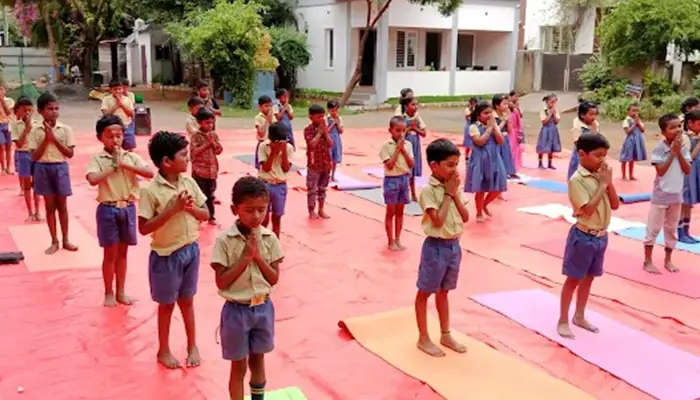 School campus includes modern infrastructure, including classrooms, safety measures, & learning spaces.