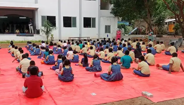 School campus equipped with safety infrastructure including CCTV surveillance and emergency systems.