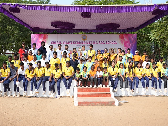 Students posing proudly for a group photo during the annual sports day celebration held in Avadi.