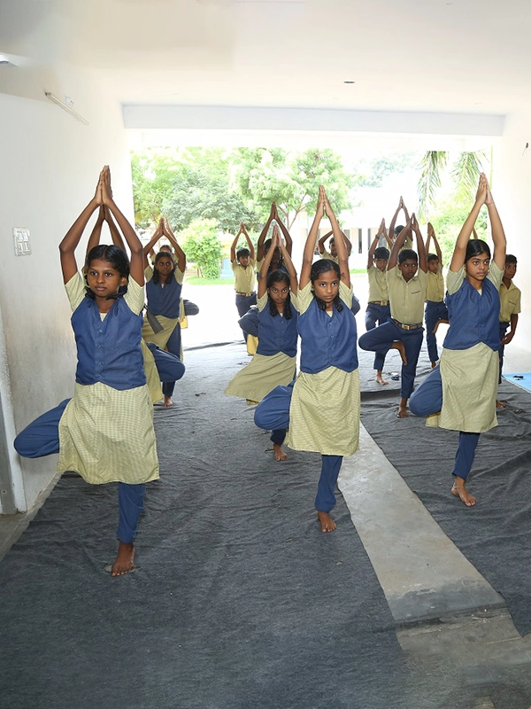 Students practicing yoga together during yoga classes gives peaceful sessions at SBVR School